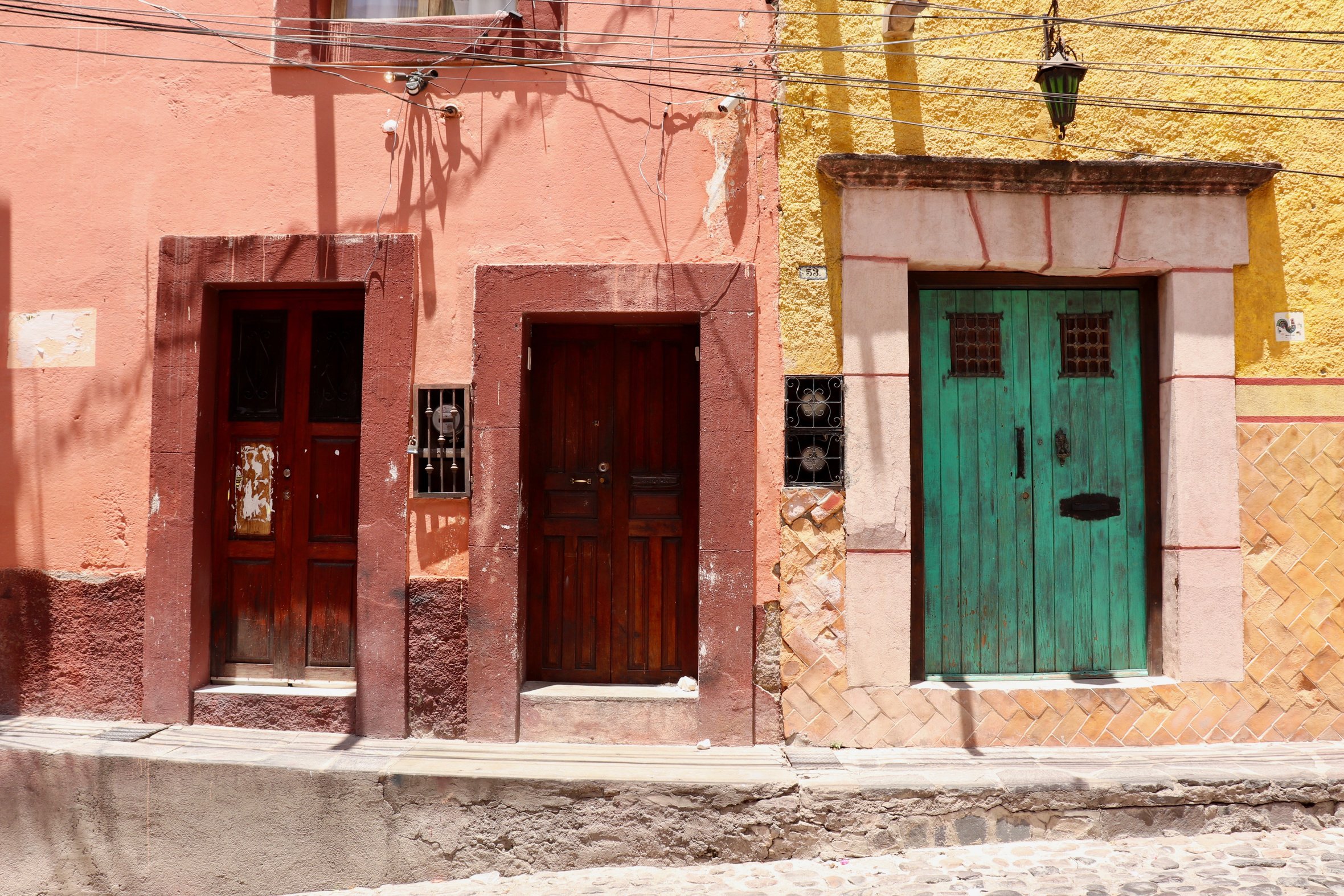 Pink And Yellow Mexican Buildings